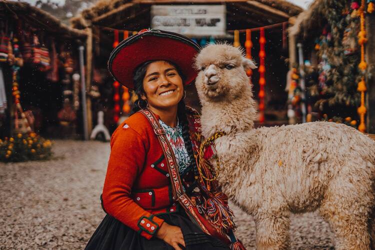 Woman with llama in Peru