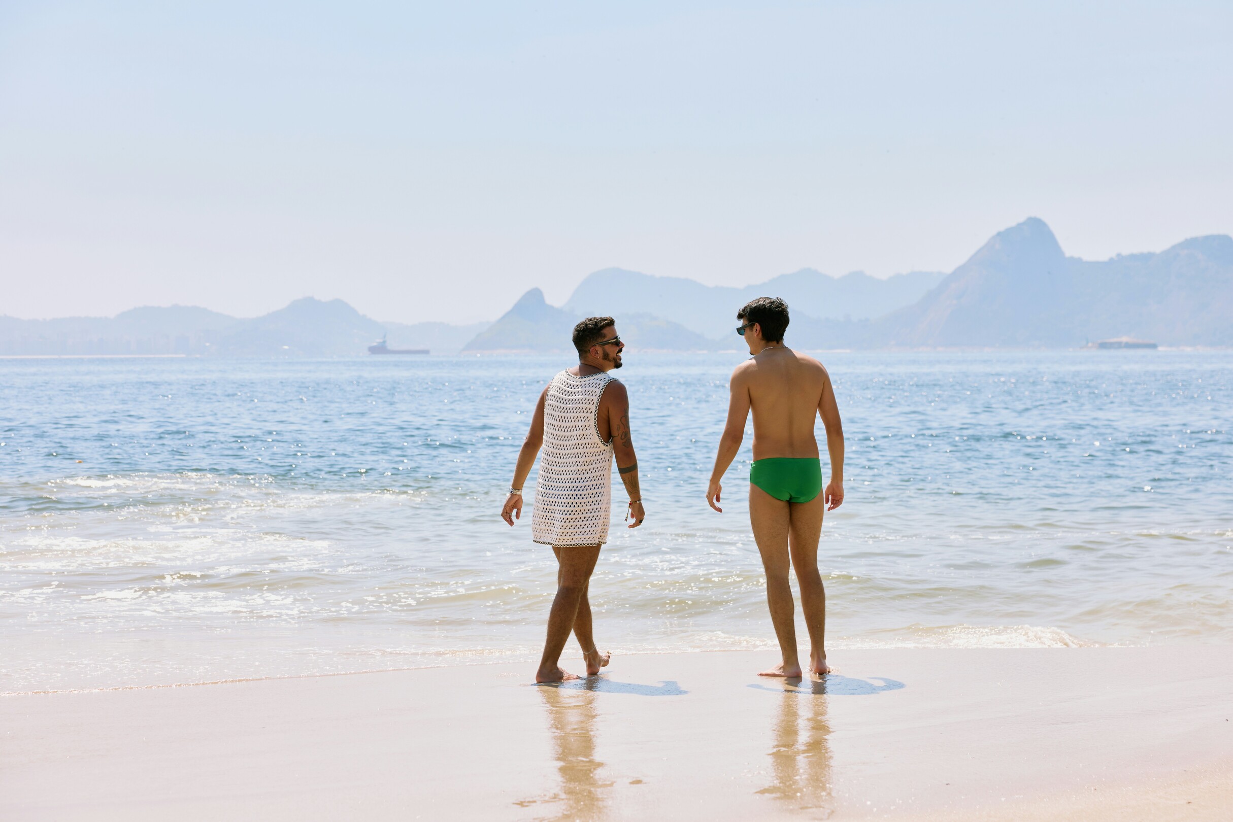 Two men on the beach LGBTQ+ trips feature