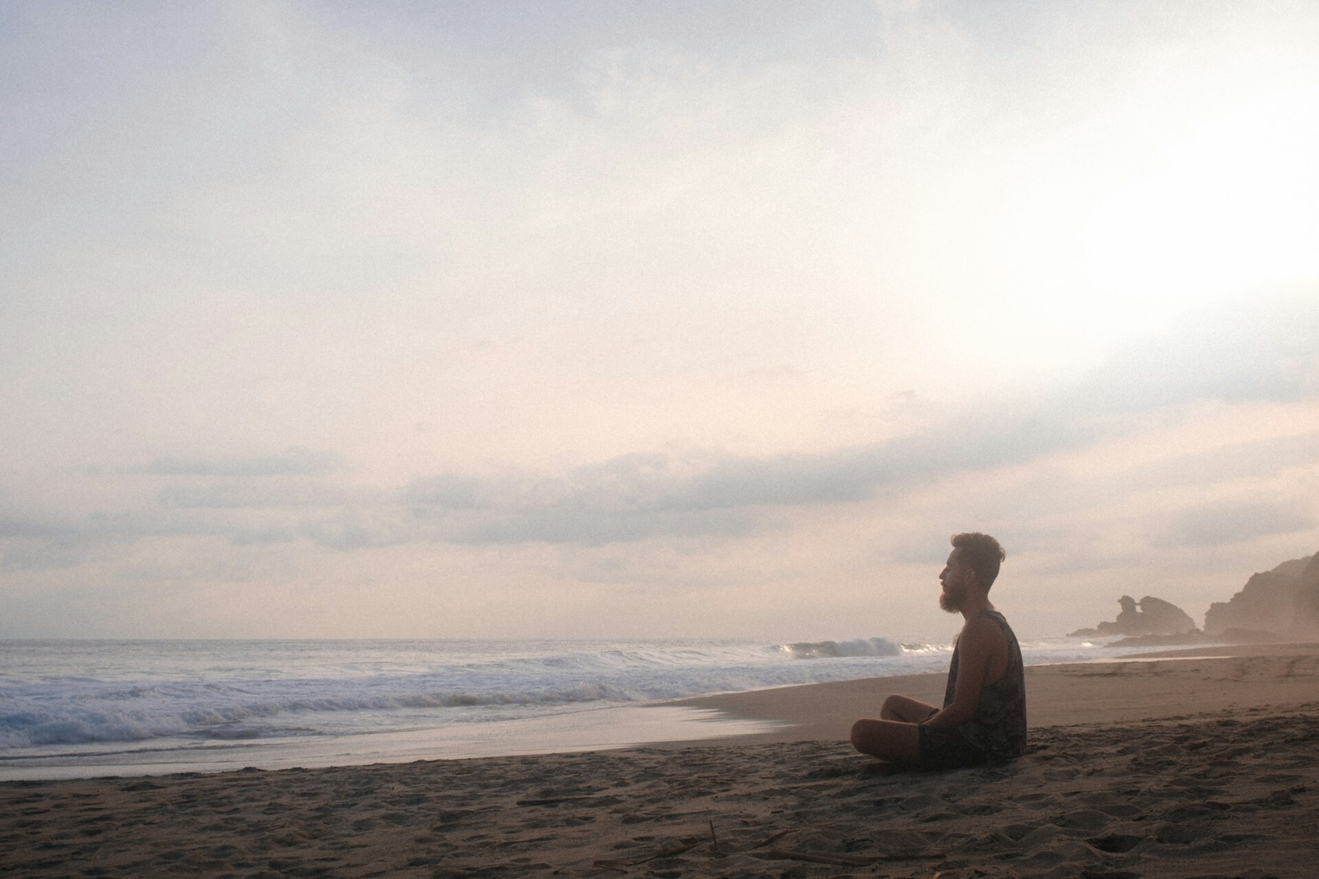 Man - beach meditation - feature