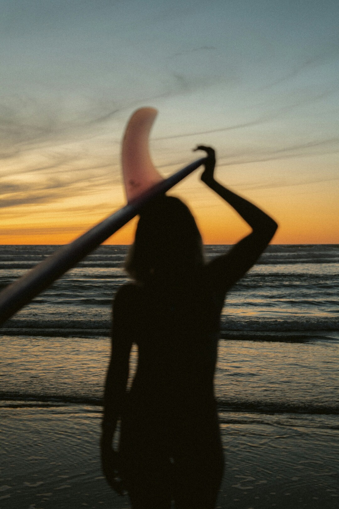 Sunset female surfer generic