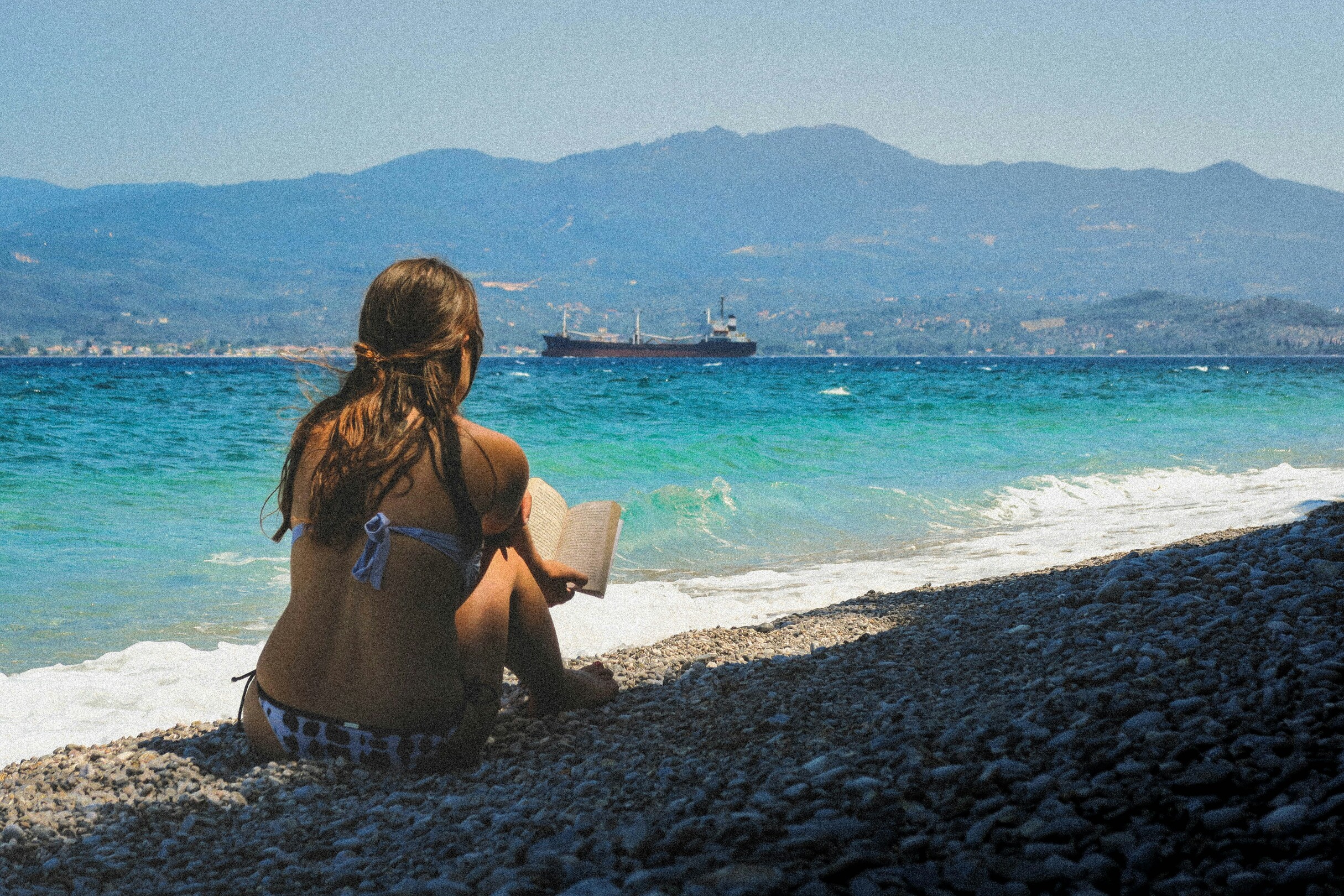 Girl-Reading-Beach-Greece Featured