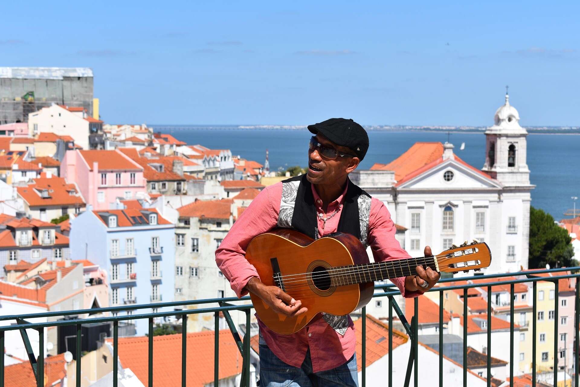 Alfama Lisbon Portugal - man - music - feature