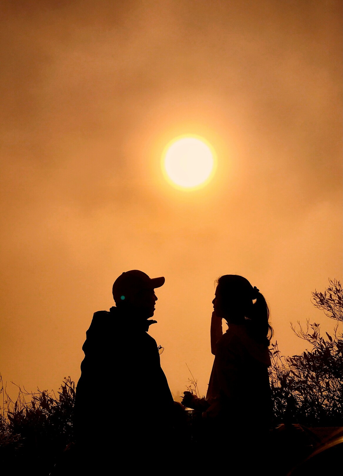 Man and woman on Mount Batur at sunrise Bangli Bali Indonesia feature
