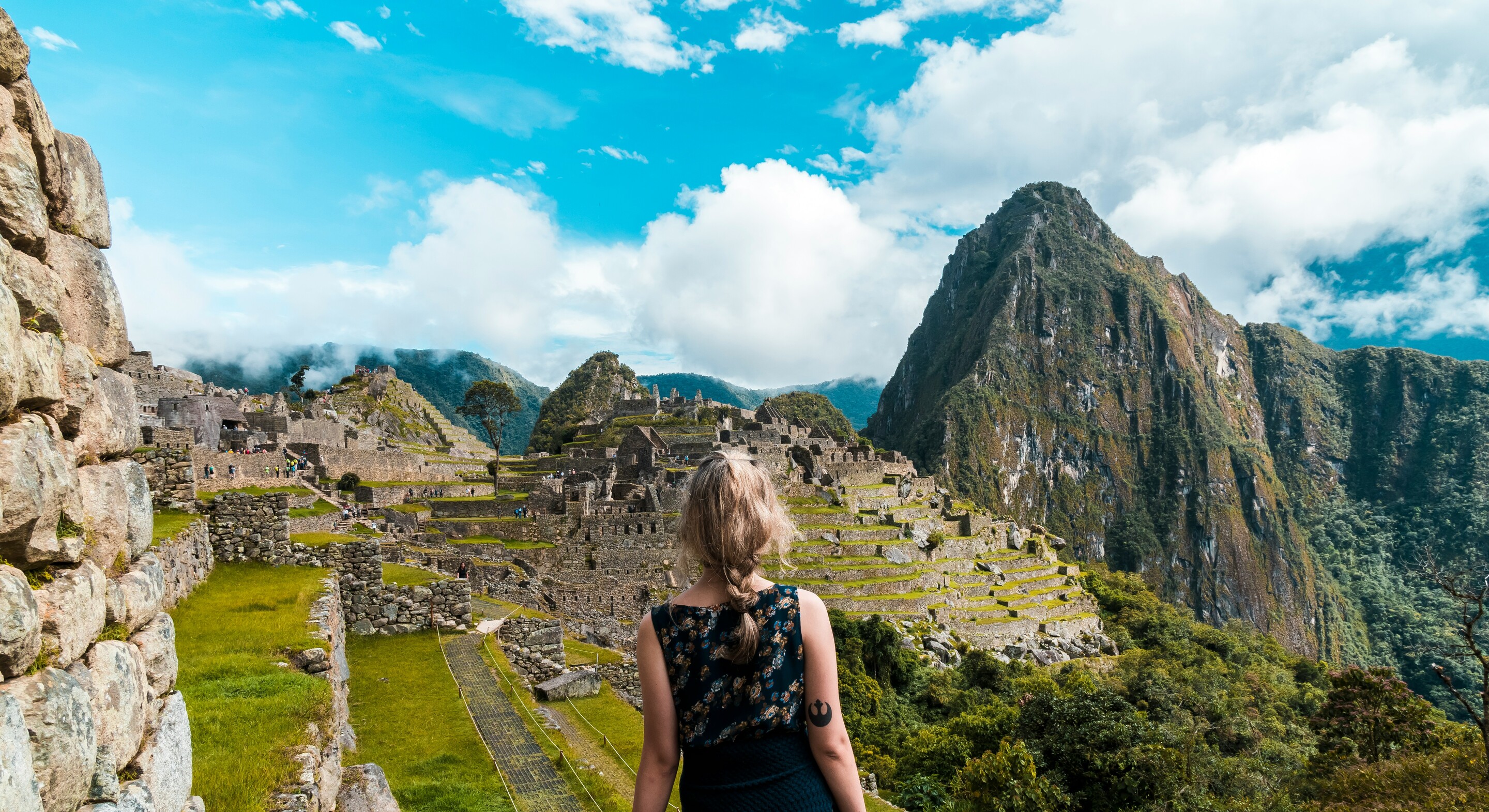 Machu Picchu woman Peru feature