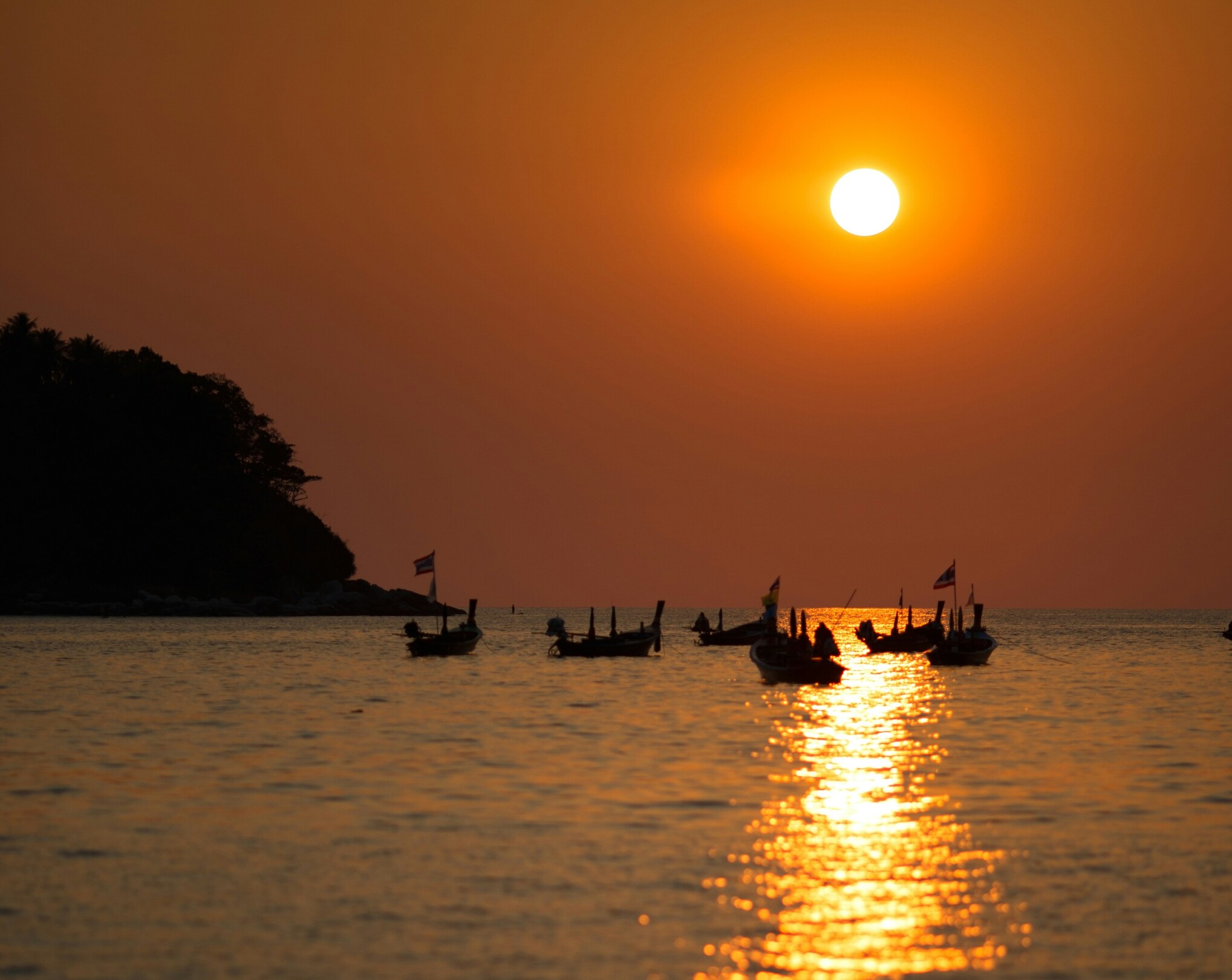 Phuket Thailand sunset view with boats feature