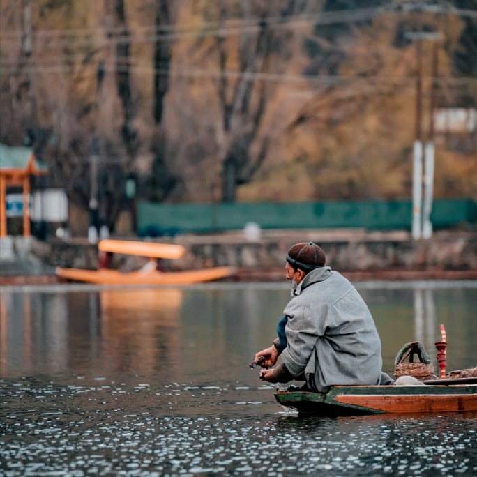 Man in boat at Kashmir Dal Lake