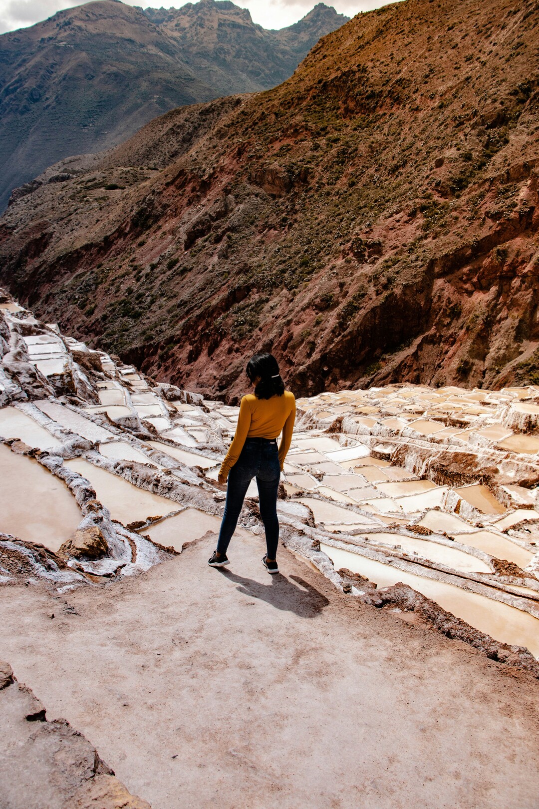 Maras Salt Mines, Peru - woman - feature