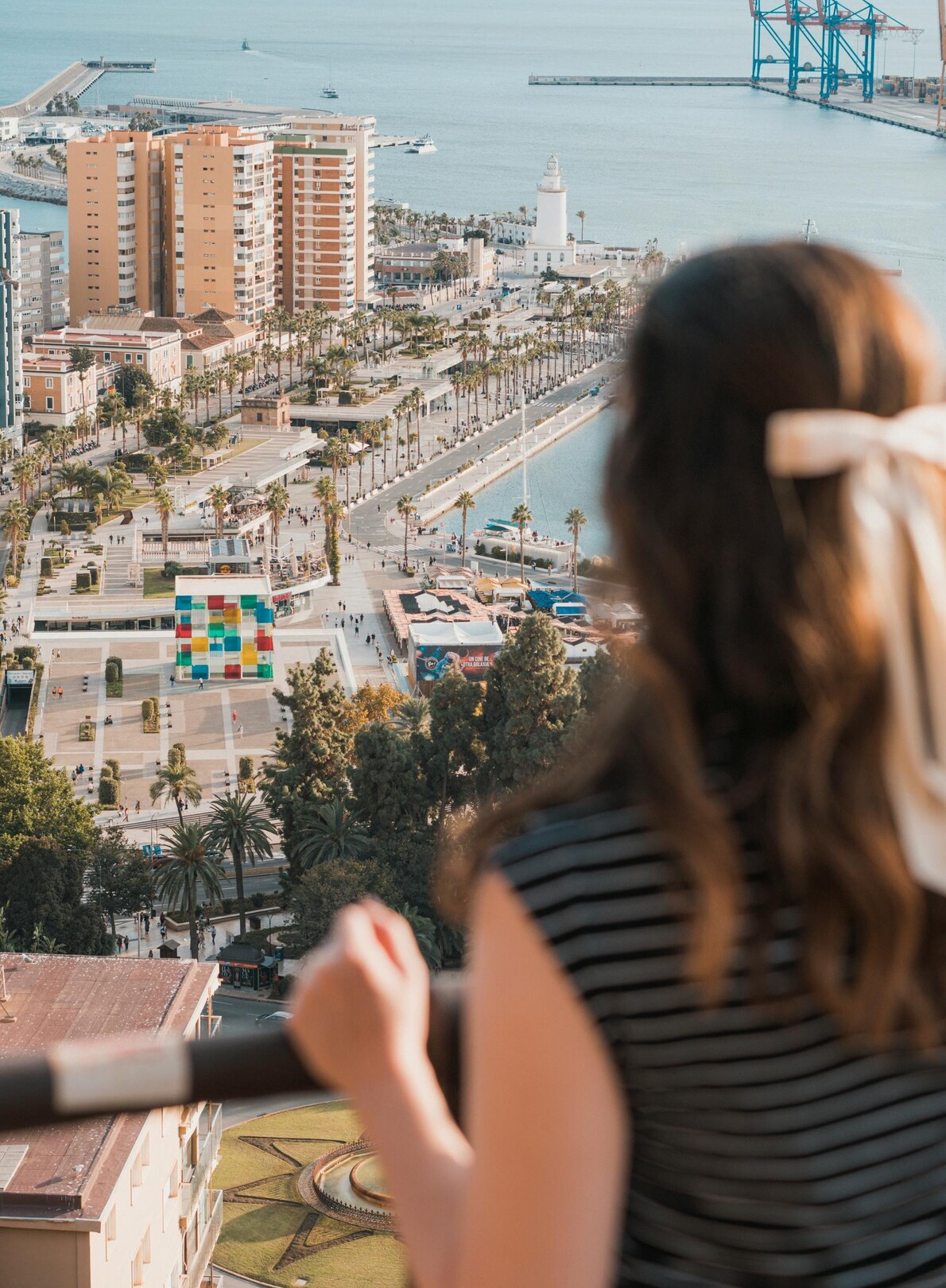 Málaga view w/ woman - featured