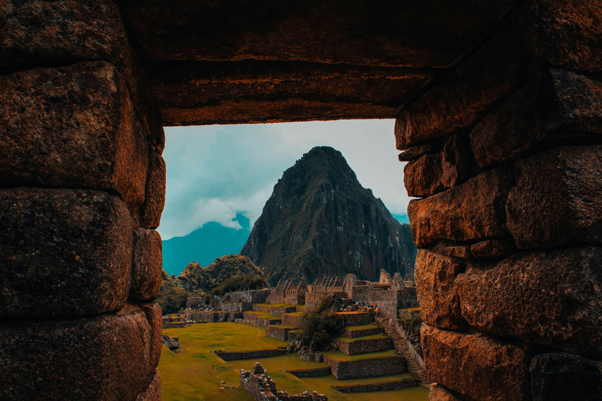 Machu Picchu in Peru framed by surrounding structures feature
